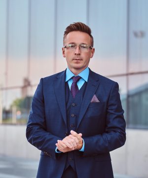 confident-businessman-dressed-in-an-elegant-suit-s-2021-08-28-00-59-34-utc