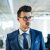 a-portrait-of-young-businessman-walking-in-an-offi-2021-08-27-16-14-46-utc
