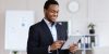 happy-african-american-businessman-using-digital-t-2022-12-16-06-55-03-utc