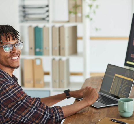 smiling-african-american-man-writing-programming-c-2021-09-24-04-09-47-utc