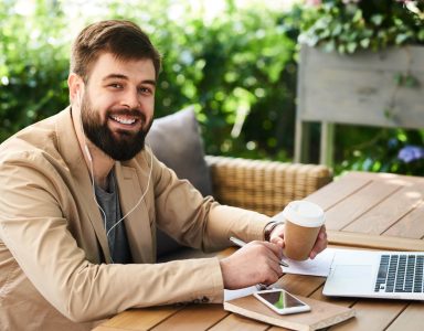 smiling-modern-businessman-working-in-cafe-2023-11-27-05-05-03-utc (Custom)
