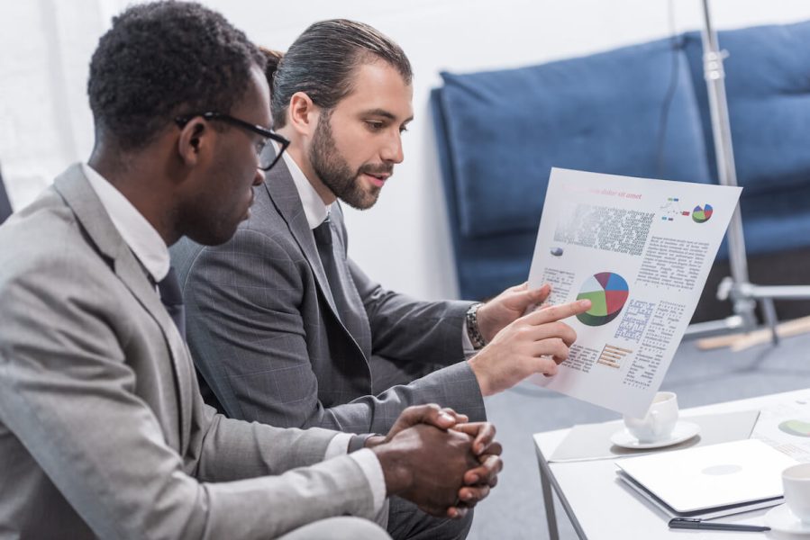 multiethnic-business-partners-looking-at-document-2024-11-18-03-51-08-utc